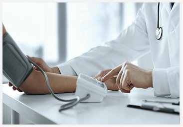 Image of a doctor take the blood pressure of a man